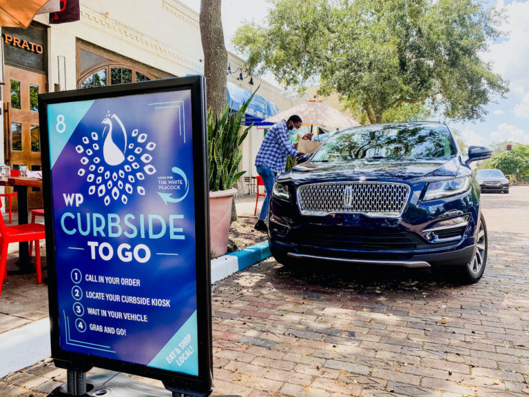 Curbside to-go pick up initiative kiosk and hand off.