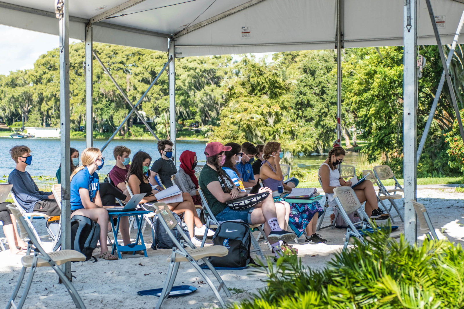 Rollins College students gather for an outdoor class.