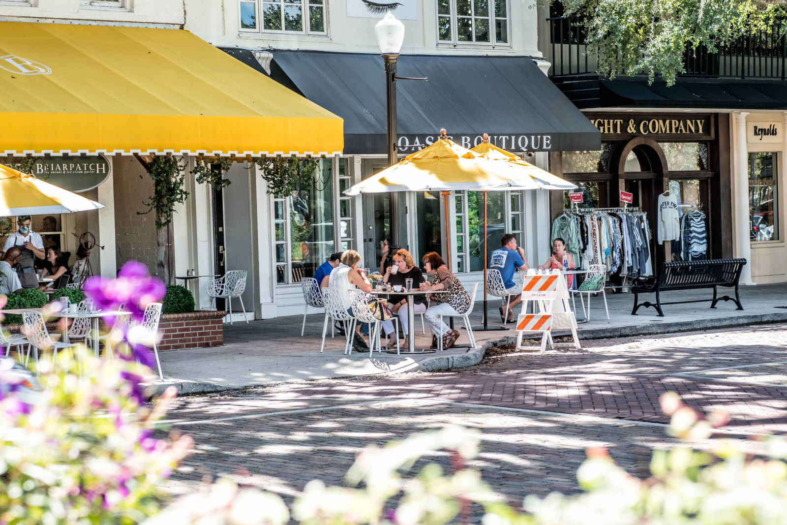 A group dines outdoors at the Briarpatch restaurant on Park Avenue.