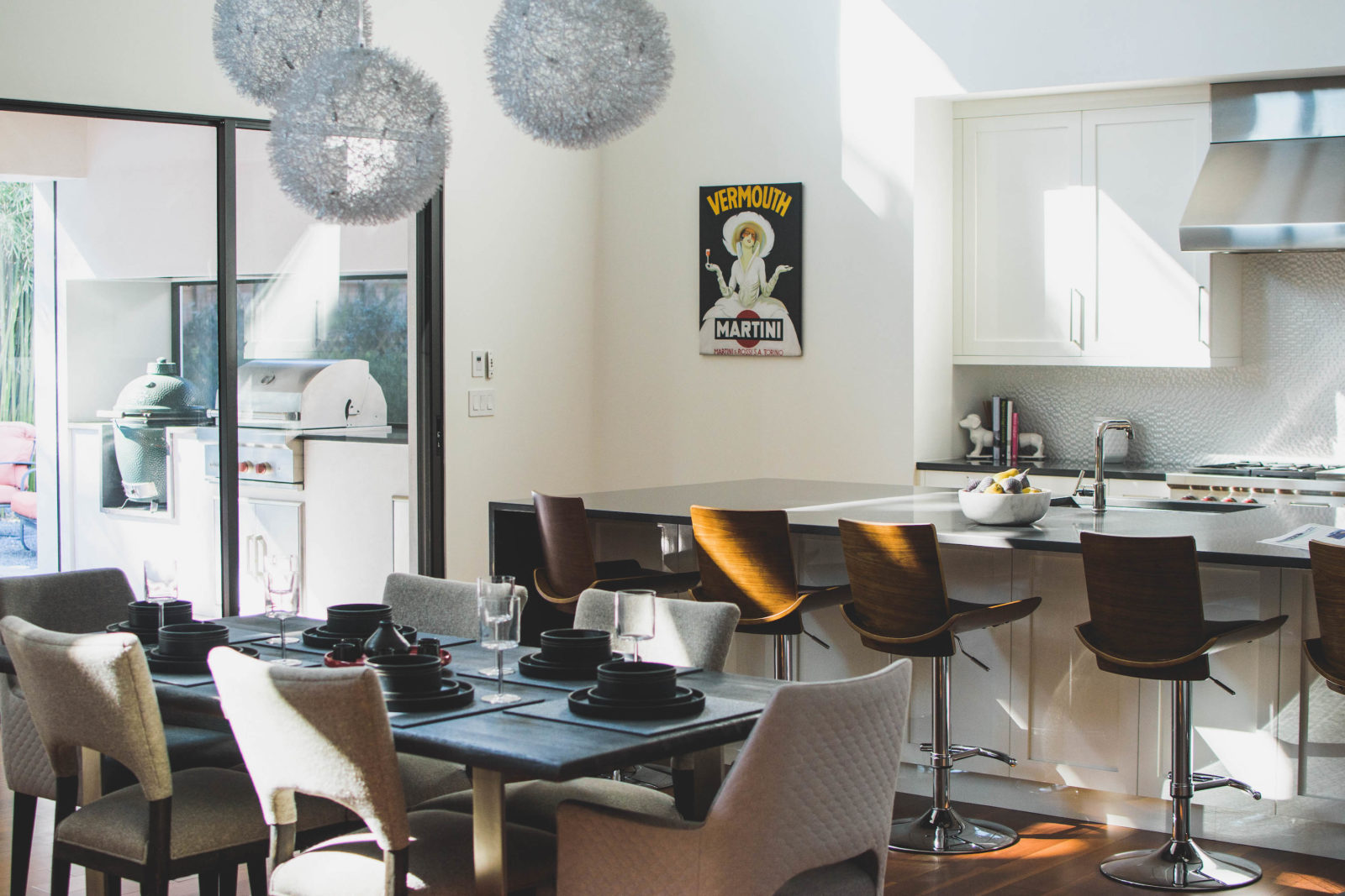 A light-filled kitchen and dining space with patio access. 