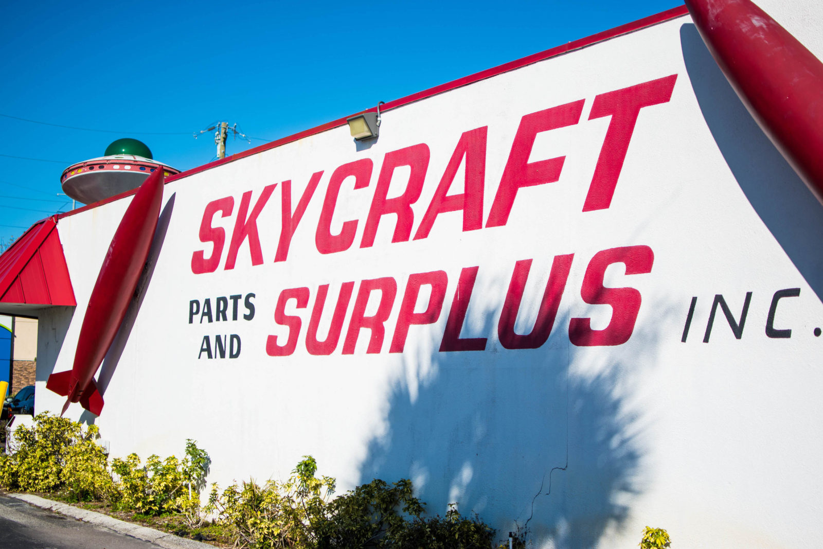 Red Skycraft Parts & Surplus building sign.