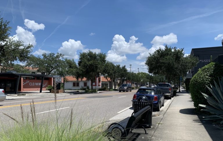 Cars parked along Orange Avenue in Winter Park, FL.