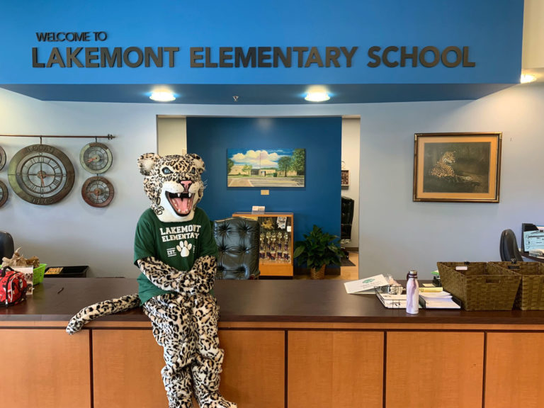 Leo the Leopard mascot sits at the Lakemont Elementary School front desk.