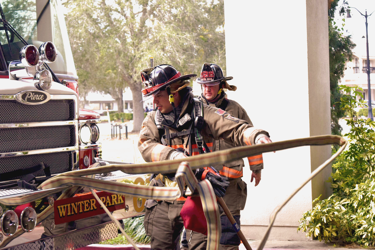 Two WPFD firefighters work on hose training.